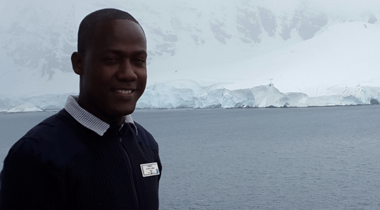 portrait in front of a ice shelf in antarctica during the celebrity millennium cruise